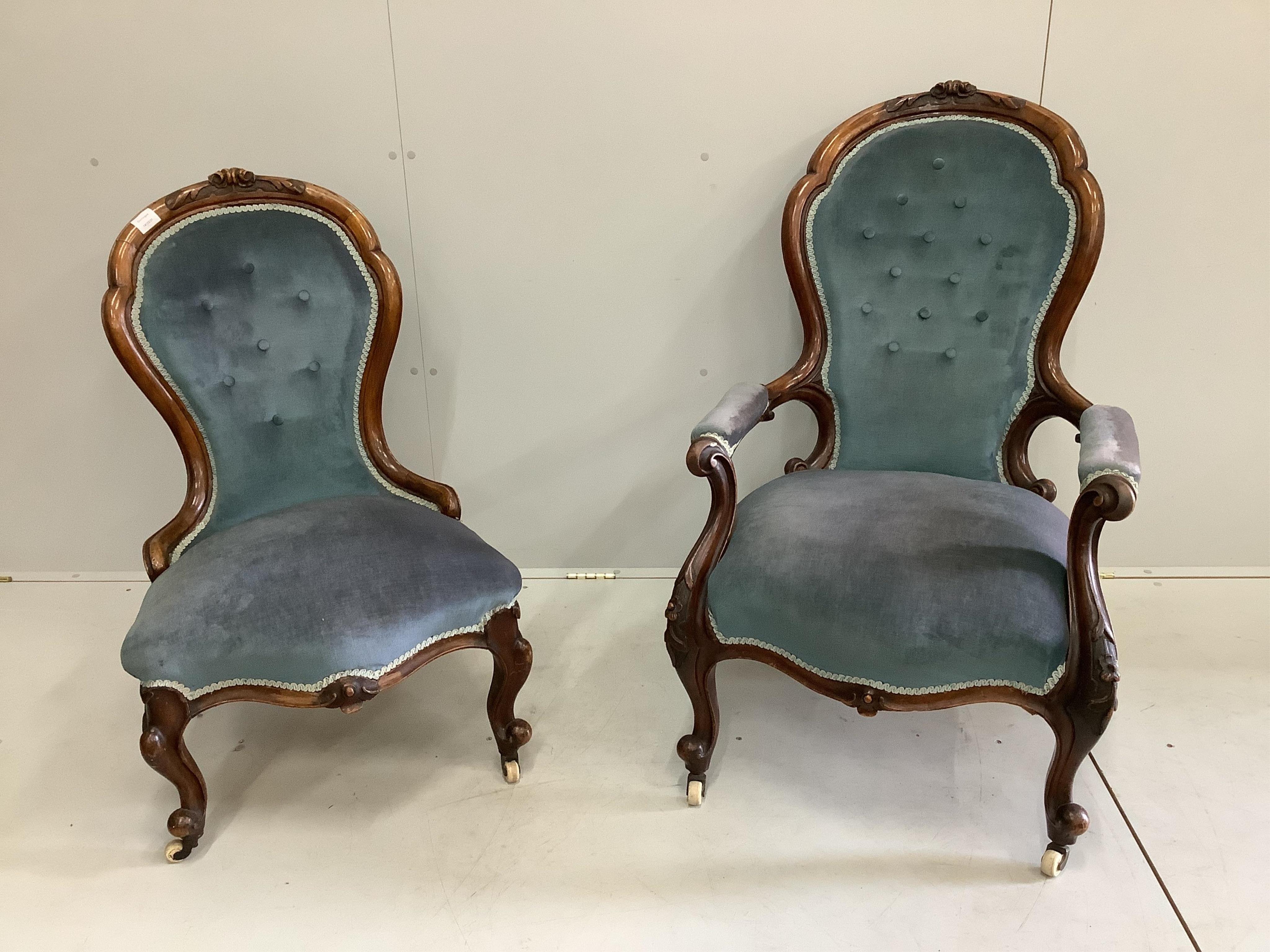 A near pair of Victorian walnut spoon back chairs, one with arms, larger width 65cm, depth 75cm, height 102cm